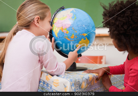 To use this stock image in your creative project, please select the size you need over to the right and click the "Add to Cart" button.
Your downloaded image will come with the Cutcaster watermark removed so don’t worry about the watermark you see on this page. Little schoolgirls looking at a globe stock photo, Little schoolgirls looking at a globe in a classroom by Wavebreak Media
