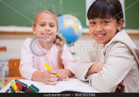 To use this stock image in your creative project, please select the size you need over to the right and click the "Add to Cart" button.
Your downloaded image will come with the Cutcaster watermark removed so don’t worry about the watermark you see on this page. Smiling schoolgirls drawing while looking at the camera stock photo, Smiling schoolgirls drawing while looking at the camera in a classroom by Wavebreak Media