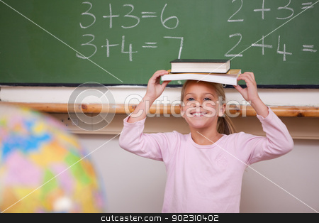 To use this stock image in your creative project, please select the size you need over to the right and click the "Add to Cart" button.
Your downloaded image will come with the Cutcaster watermark removed so don’t worry about the watermark you see on this page. Cute schoolgirl holding her book on her head stock photo, Cute schoolgirl holding her book on her head in a classroom by Wavebreak Media