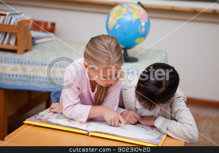 To use this stock image in your creative project, please select the size you need over to the right and click the "Add to Cart" button.
Your downloaded image will come with the Cutcaster watermark removed so don’t worry about the watermark you see on this page. Schoolgirls reading a fairy tale stock photo, Schoolgirls reading a fairy tale in a classroom by Wavebreak Media