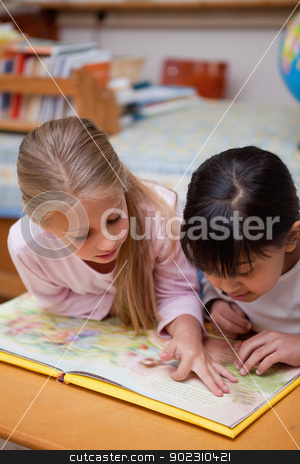 To use this stock image in your creative project, please select the size you need over to the right and click the "Add to Cart" button.
Your downloaded image will come with the Cutcaster watermark removed so don’t worry about the watermark you see on this page. Portrait of schoolgirls reading a fairy tale stock photo, Portrait of schoolgirls reading a fairy tale in a classroom by Wavebreak Media