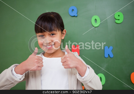 To use this stock image in your creative project, please select the size you need over to the right and click the "Add to Cart" button.
Your downloaded image will come with the Cutcaster watermark removed so don’t worry about the watermark you see on this page. Happy schoolgirl with the thumbs up stock photo, Happy schoolgirl with the thumbs up in front of a blackboard by Wavebreak Media