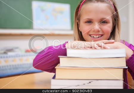 To use this stock image in your creative project, please select the size you need over to the right and click the "Add to Cart" button.
Your downloaded image will come with the Cutcaster watermark removed so don’t worry about the watermark you see on this page. Schoolgirl posing with a stack of books stock photo, Schoolgirl posing with a stack of books in a classroom by Wavebreak Media