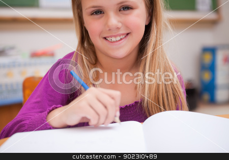 To use this stock image in your creative project, please select the size you need over to the right and click the "Add to Cart" button.
Your downloaded image will come with the Cutcaster watermark removed so don’t worry about the watermark you see on this page. Close up of a young schoolgirl writing stock photo, Close up of a young schoolgirl writing in a classroom by Wavebreak Media