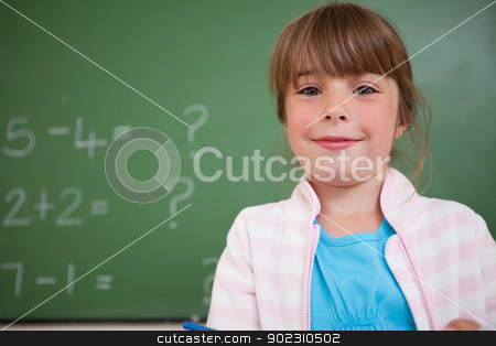 To use this stock image in your creative project, please select the size you need over to the right and click the "Add to Cart" button.
Your downloaded image will come with the Cutcaster watermark removed so don’t worry about the watermark you see on this page. Little girl standing up stock photo, Little girl standing up in front of a blackboard by Wavebreak Media