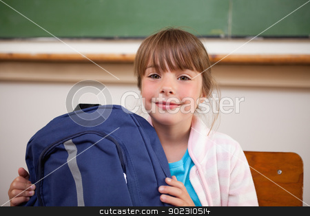 To use this stock image in your creative project, please select the size you need over to the right and click the "Add to Cart" button.
Your downloaded image will come with the Cutcaster watermark removed so don’t worry about the watermark you see on this page. Happy schoolgirl posing with a bag stock photo, Happy schoolgirl posing with a bag in a classroom by Wavebreak Media