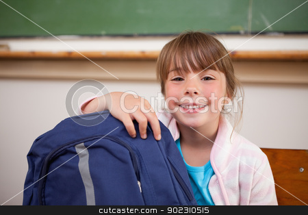 To use this stock image in your creative project, please select the size you need over to the right and click the "Add to Cart" button.
Your downloaded image will come with the Cutcaster watermark removed so don’t worry about the watermark you see on this page. Smiling schoolgirl posing with a bag stock photo, Smiling schoolgirl posing with a bag in a classroom by Wavebreak Media