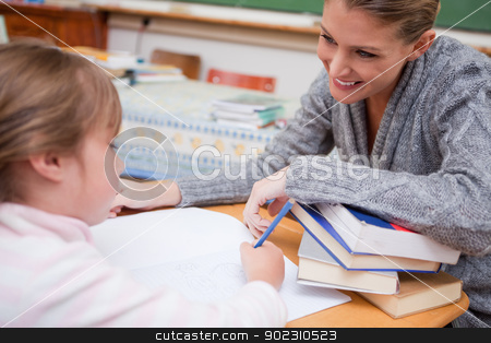 To use this stock image in your creative project, please select the size you need over to the right and click the "Add to Cart" button.
Your downloaded image will come with the Cutcaster watermark removed so don’t worry about the watermark you see on this page. Schoolgirl writing with her smiling teacher stock photo, Schoolgirl writing with her smiling teacher in a classroom by Wavebreak Media