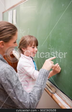 To use this stock image in your creative project, please select the size you need over to the right and click the "Add to Cart" button.
Your downloaded image will come with the Cutcaster watermark removed so don’t worry about the watermark you see on this page. Portrait of a teacher and a pupil making an addition stock photo, Portrait of a teacher and a pupil making an addition on a blackboard by Wavebreak Media