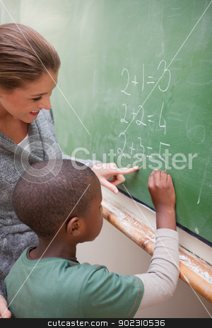 To use this stock image in your creative project, please select the size you need over to the right and click the "Add to Cart" button.
Your downloaded image will come with the Cutcaster watermark removed so don’t worry about the watermark you see on this page. Portrait of a cute teacher and a pupil making an addition stock photo, Portrait of a cute teacher and a pupil making an addition on a blackboard by Wavebreak Media
