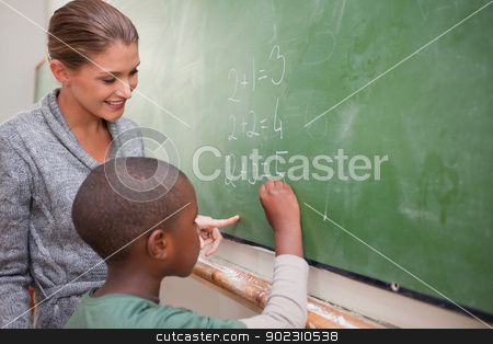To use this stock image in your creative project, please select the size you need over to the right and click the "Add to Cart" button.
Your downloaded image will come with the Cutcaster watermark removed so don’t worry about the watermark you see on this page. Cute teacher and a pupil making an addition stock photo, Cute teacher and a pupil making an addition on a blackboard by Wavebreak Media