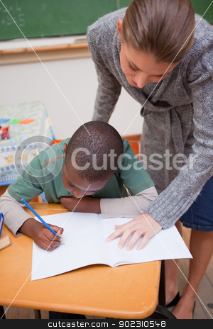 To use this stock image in your creative project, please select the size you need over to the right and click the "Add to Cart" button.
Your downloaded image will come with the Cutcaster watermark removed so don’t worry about the watermark you see on this page. Portrait of a teacher explaining something to a focused schoolbo stock photo, Portrait of a teacher explaining something to a focused schoolboy in a classroom by Wavebreak Media