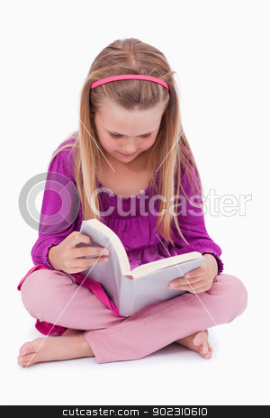 To use this stock image in your creative project, please select the size you need over to the right and click the "Add to Cart" button.
Your downloaded image will come with the Cutcaster watermark removed so don’t worry about the watermark you see on this page. Portrait of a cute girl reading a book stock photo, Portrait of a cute girl reading a book against a white background by Wavebreak Media