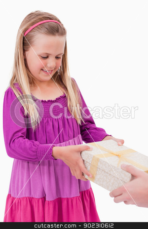 To use this stock image in your creative project, please select the size you need over to the right and click the "Add to Cart" button.
Your downloaded image will come with the Cutcaster watermark removed so don’t worry about the watermark you see on this page. Portrait of a girl receiving a present stock photo, Portrait of a girl receiving a present against a white background by Wavebreak Media