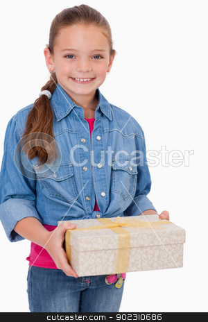 To use this stock image in your creative project, please select the size you need over to the right and click the "Add to Cart" button.
Your downloaded image will come with the Cutcaster watermark removed so don’t worry about the watermark you see on this page. Portrait of a girl holding a gift box stock photo, Portrait of a girl holding a gift box against a white background by Wavebreak Media