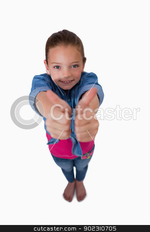 To use this stock image in your creative project, please select the size you need over to the right and click the "Add to Cart" button.
Your downloaded image will come with the Cutcaster watermark removed so don’t worry about the watermark you see on this page. Portrait of a playful girl with the thumbs up stock photo, Portrait of a playful girl with the thumbs up against a white background by Wavebreak Media