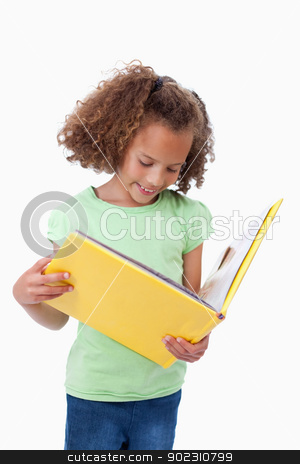 To use this stock image in your creative project, please select the size you need over to the right and click the "Add to Cart" button.
Your downloaded image will come with the Cutcaster watermark removed so don’t worry about the watermark you see on this page. Portrait of a girl reading a fairy tale stock photo, Portrait of a girl reading a fairy tale against a white background by Wavebreak Media