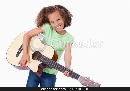 To use this stock image in your creative project, please select the size you need over to the right and click the "Add to Cart" button.
Your downloaded image will come with the Cutcaster watermark removed so don’t worry about the watermark you see on this page. Happy girl playing the guitar stock photo, Happy girl playing the guitar against a white background by Wavebreak Media