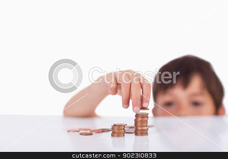 To use this stock image in your creative project, please select the size you need over to the right and click the "Add to Cart" button.
Your downloaded image will come with the Cutcaster watermark removed so don’t worry about the watermark you see on this page. Young boy counting his change stock photo, Young boy counting his change against a white background by Wavebreak Media