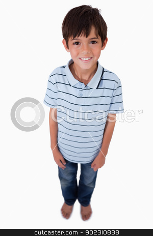 To use this stock image in your creative project, please select the size you need over to the right and click the "Add to Cart" button.
Your downloaded image will come with the Cutcaster watermark removed so don’t worry about the watermark you see on this page. Portrait of a boy smiling at the camera stock photo, Portrait of a boy smiling at the camera against a white background by Wavebreak Media