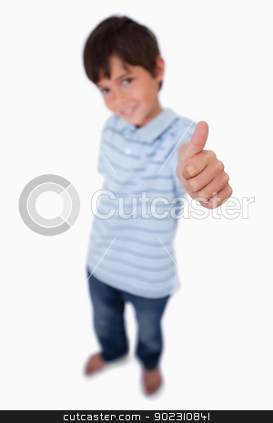 To use this stock image in your creative project, please select the size you need over to the right and click the "Add to Cart" button.
Your downloaded image will come with the Cutcaster watermark removed so don’t worry about the watermark you see on this page. Portrait of a happy boy smiling at the camera with the thumb up stock photo, Portrait of a happy boy smiling at the camera with the thumb up against a white background by Wavebreak Media