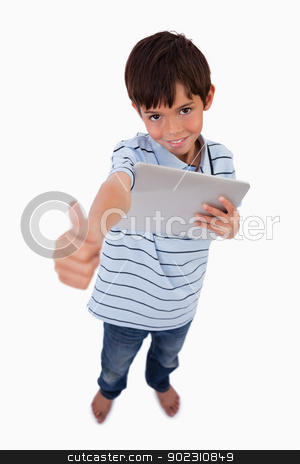 To use this stock image in your creative project, please select the size you need over to the right and click the "Add to Cart" button.
Your downloaded image will come with the Cutcaster watermark removed so don’t worry about the watermark you see on this page. Portrait of a boy using a tablet computer with the thumb up stock photo, Portrait of a boy using a tablet computer with the thumb up against a white background by Wavebreak Media