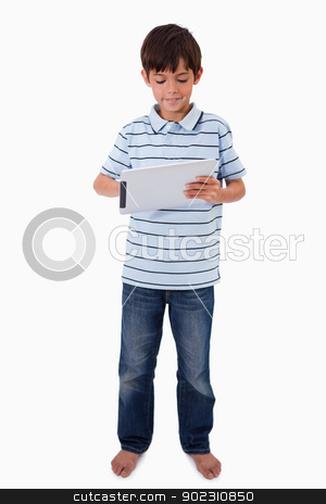 To use this stock image in your creative project, please select the size you need over to the right and click the "Add to Cart" button.
Your downloaded image will come with the Cutcaster watermark removed so don’t worry about the watermark you see on this page. Portrait of a smiling boy using a tablet computer stock photo, Portrait of a smiling boy using a tablet computer against a white background by Wavebreak Media