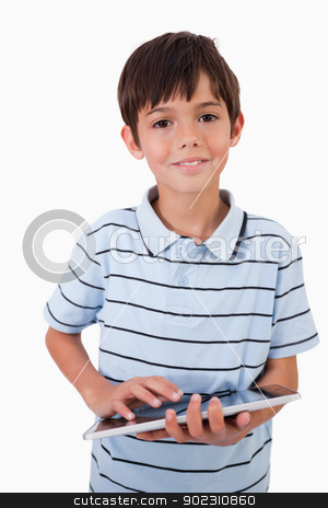 To use this stock image in your creative project, please select the size you need over to the right and click the "Add to Cart" button.
Your downloaded image will come with the Cutcaster watermark removed so don’t worry about the watermark you see on this page. Portrait of a cute little boy using a tablet computer stock photo, Portrait of a cute little boy using a tablet computer against a white background by Wavebreak Media