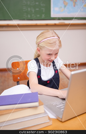 To use this stock image in your creative project, please select the size you need over to the right and click the "Add to Cart" button.
Your downloaded image will come with the Cutcaster watermark removed so don’t worry about the watermark you see on this page. Portrait of a little girl using a laptop stock photo, Portrait of a little girl using a laptop in a classroom by Wavebreak Media