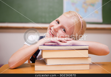 To use this stock image in your creative project, please select the size you need over to the right and click the "Add to Cart" button.
Your downloaded image will come with the Cutcaster watermark removed so don’t worry about the watermark you see on this page. Smiling girl leaning on books stock photo, Smiling girl leaning on books in a classroom by Wavebreak Media