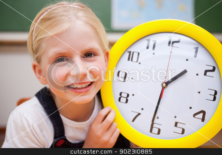 To use this stock image in your creative project, please select the size you need over to the right and click the "Add to Cart" button.
Your downloaded image will come with the Cutcaster watermark removed so don’t worry about the watermark you see on this page. Schoolgirl showing a clock stock photo, Schoolgirl showing a clock in a classroom by Wavebreak Media