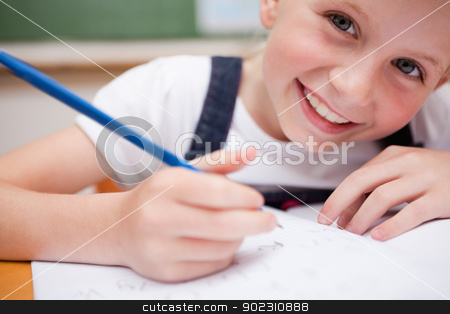 To use this stock image in your creative project, please select the size you need over to the right and click the "Add to Cart" button.
Your downloaded image will come with the Cutcaster watermark removed so don’t worry about the watermark you see on this page. Close up of a smiling schoolgirl writing something stock photo, Close up of a smiling schoolgirl writing something in a classroom by Wavebreak Media