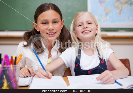To use this stock image in your creative project, please select the size you need over to the right and click the "Add to Cart" button.
Your downloaded image will come with the Cutcaster watermark removed so don’t worry about the watermark you see on this page. Smiling pupils working together on an assignment stock photo, Smiling pupils working together on an assignment in a classroom by Wavebreak Media