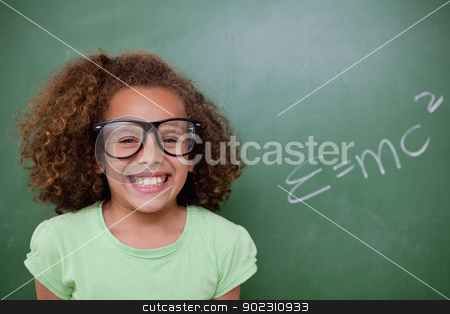 To use this stock image in your creative project, please select the size you need over to the right and click the "Add to Cart" button.
Your downloaded image will come with the Cutcaster watermark removed so don’t worry about the watermark you see on this page. Schoolgirl posing with the the mass-energy equivalence formula stock photo, Schoolgirl posing with the the mass-energy equivalence formula on a blackboard by Wavebreak Media