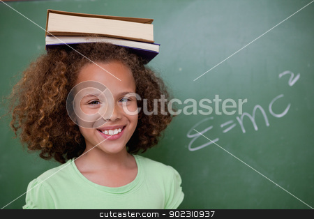 To use this stock image in your creative project, please select the size you need over to the right and click the "Add to Cart" button.
Your downloaded image will come with the Cutcaster watermark removed so don’t worry about the watermark you see on this page. Happy schoolgirl holding her book on her head stock photo, Happy schoolgirl holding her book on her head in front of a blackboard by Wavebreak Media