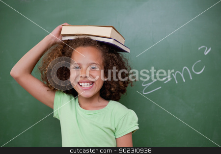 To use this stock image in your creative project, please select the size you need over to the right and click the "Add to Cart" button.
Your downloaded image will come with the Cutcaster watermark removed so don’t worry about the watermark you see on this page. Cheerful schoolgirl holding her book on her head stock photo, Cheerful schoolgirl holding her book on her head in front of a blackboard by Wavebreak Media