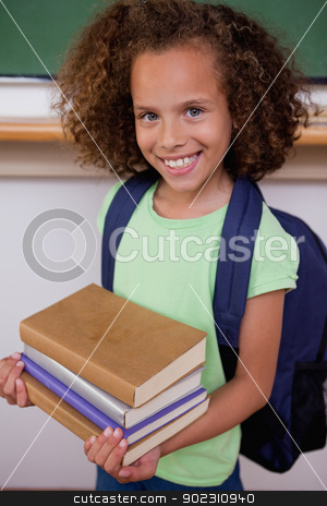 To use this stock image in your creative project, please select the size you need over to the right and click the "Add to Cart" button.
Your downloaded image will come with the Cutcaster watermark removed so don’t worry about the watermark you see on this page. Portrait of a schoolgirl holding her books stock photo, Portrait of a schoolgirl holding her books in a classroom by Wavebreak Media