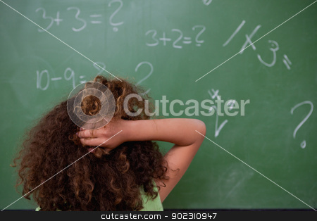 To use this stock image in your creative project, please select the size you need over to the right and click the "Add to Cart" button.
Your downloaded image will come with the Cutcaster watermark removed so don’t worry about the watermark you see on this page. Schoolgirl thinking about mathematics while scratching the back stock photo, Schoolgirl thinking about mathematics while scratching the back of her head in front of a blackboard by Wavebreak Media