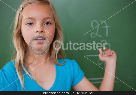To use this stock image in your creative project, please select the size you need over to the right and click the "Add to Cart" button.
Your downloaded image will come with the Cutcaster watermark removed so don’t worry about the watermark you see on this page. Little schoolgirl showing her result stock photo, Little schoolgirl showing her result on a blackboard by Wavebreak Media
