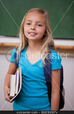 To use this stock image in your creative project, please select the size you need over to the right and click the "Add to Cart" button.
Your downloaded image will come with the Cutcaster watermark removed so don’t worry about the watermark you see on this page. Portrait of a blonde schoolgirl holding her books stock photo, Portrait of a blonde schoolgirl holding her books in a classroom by Wavebreak Media