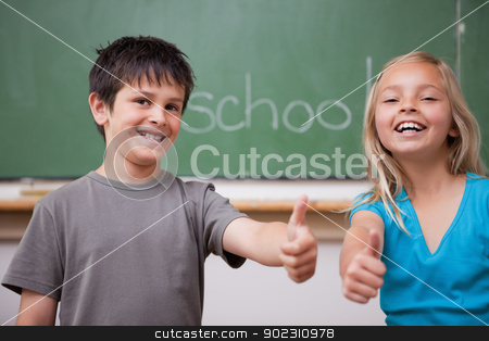 To use this stock image in your creative project, please select the size you need over to the right and click the "Add to Cart" button.
Your downloaded image will come with the Cutcaster watermark removed so don’t worry about the watermark you see on this page. Happy pupils posing with the thumb up stock photo, Happy pupils posing with the thumb up in a classroom by Wavebreak Media