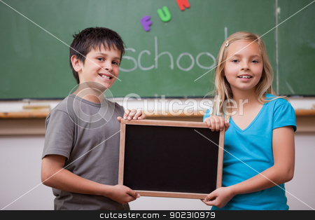 To use this stock image in your creative project, please select the size you need over to the right and click the "Add to Cart" button.
Your downloaded image will come with the Cutcaster watermark removed so don’t worry about the watermark you see on this page. Pupils holding a school slate stock photo, Pupils holding a school slate in a classroom by Wavebreak Media
