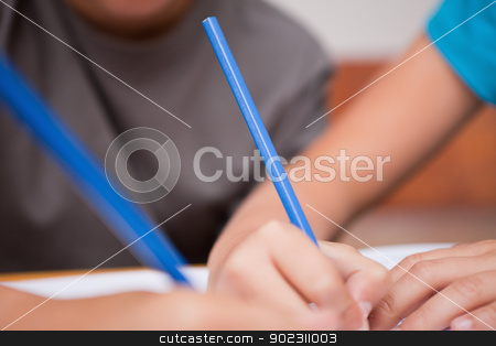 To use this stock image in your creative project, please select the size you need over to the right and click the "Add to Cart" button.
Your downloaded image will come with the Cutcaster watermark removed so don’t worry about the watermark you see on this page. Close up of two arms holding pens stock photo, Close up of two arms holding pens in a classroom by Wavebreak Media