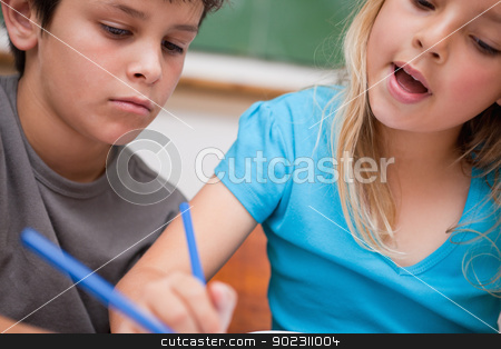 To use this stock image in your creative project, please select the size you need over to the right and click the "Add to Cart" button.
Your downloaded image will come with the Cutcaster watermark removed so don’t worry about the watermark you see on this page. Close up of two children writing stock photo, Close up of two children writing in a classroom by Wavebreak Media