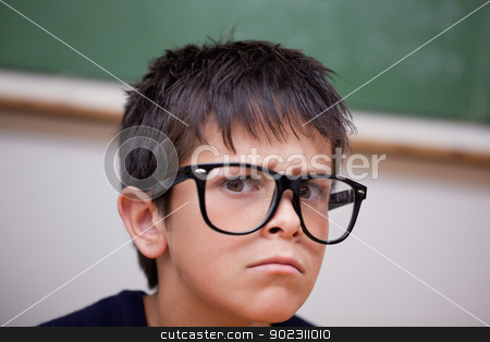 To use this stock image in your creative project, please select the size you need over to the right and click the "Add to Cart" button.
Your downloaded image will come with the Cutcaster watermark removed so don’t worry about the watermark you see on this page. Close up of a serious schoolboy stock photo, Close up of a serious schoolboy in a classroom by Wavebreak Media