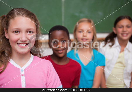 To use this stock image in your creative project, please select the size you need over to the right and click the "Add to Cart" button.
Your downloaded image will come with the Cutcaster watermark removed so don’t worry about the watermark you see on this page. Classmates posing in a row stock photo, Classmates posing in a row in a classroom by Wavebreak Media