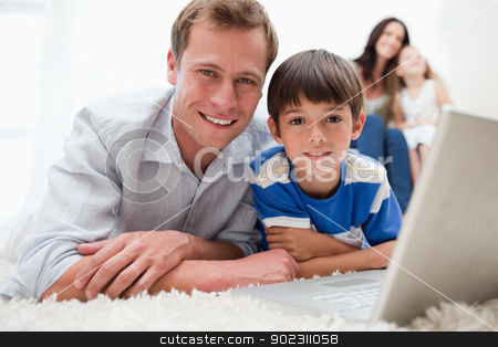 To use this stock image in your creative project, please select the size you need over to the right and click the "Add to Cart" button.
Your downloaded image will come with the Cutcaster watermark removed so don’t worry about the watermark you see on this page. Boy with his father using laptop on the carpet stock photo, Boy with his father using laptop together on the carpet by Wavebreak Media
