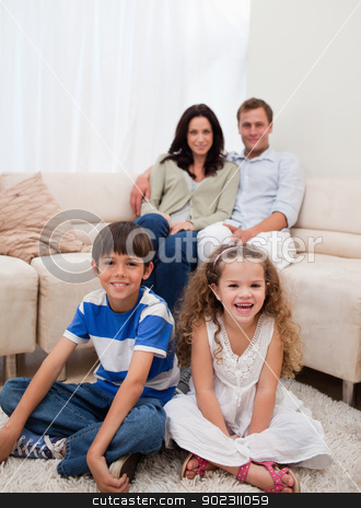 To use this stock image in your creative project, please select the size you need over to the right and click the "Add to Cart" button.
Your downloaded image will come with the Cutcaster watermark removed so don’t worry about the watermark you see on this page. Cheerful family in the living room stock photo, Cheerful family sitting in the living room by Wavebreak Media