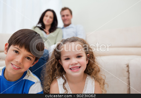 To use this stock image in your creative project, please select the size you need over to the right and click the "Add to Cart" button.
Your downloaded image will come with the Cutcaster watermark removed so don’t worry about the watermark you see on this page. Family sitting in the living room stock photo, Smiling family sitting in the living room by Wavebreak Media