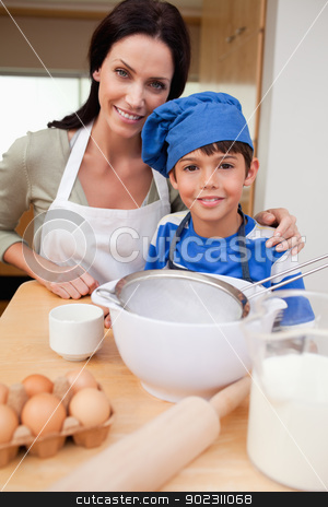 To use this stock image in your creative project, please select the size you need over to the right and click the "Add to Cart" button.
Your downloaded image will come with the Cutcaster watermark removed so don’t worry about the watermark you see on this page. Son and mother preparing cake stock photo, Son and mother preparing cake together by Wavebreak Media